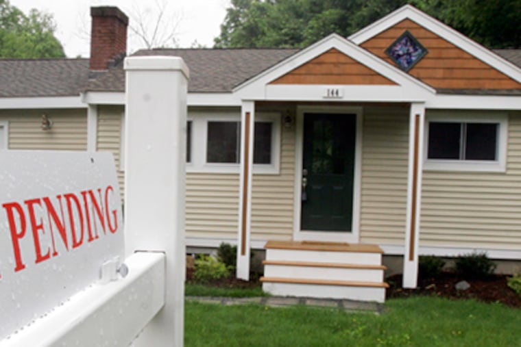 A house under contract in Framingham, Mass. With large numbers of purchase contracts going to settlement in May and June, sales should remain up through early summer, observers said. (Bill Sikes / Associated Press)
