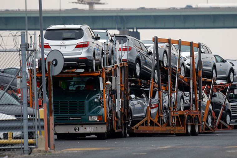 Hyundai automobiles sit on a transporter in a lot in South Philadelphia on Thursday, May 22, 2014. ( Yong Kim / Staff Photographer )