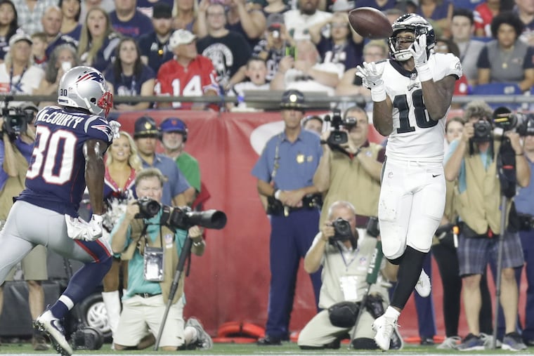 Eagles wide receiver Shelton Gibson catches a second-quarter touchdown reception past New England Patriots cornerback Jason McCourty during a preseason game at Gillette Stadium in Foxborough, MA on Thursday, August 16, 2018. YONG KIM / Staff Photographer