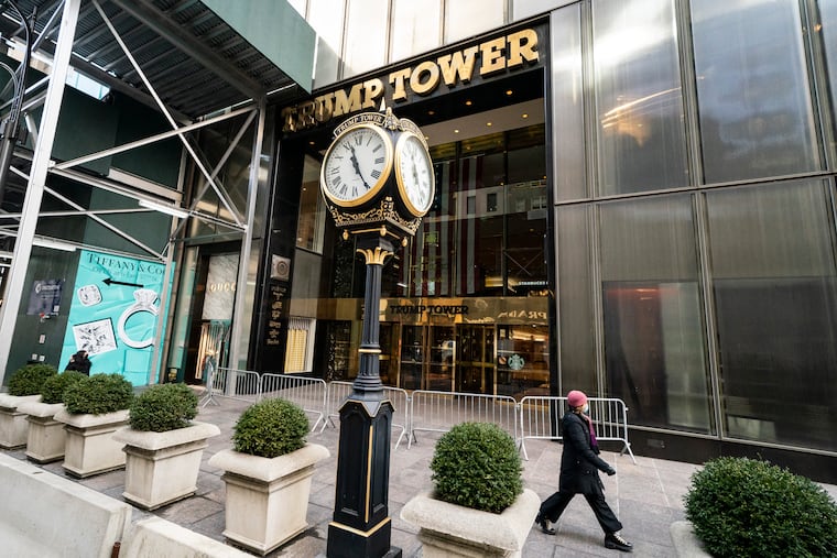Pedestrians pass security barricades in front of Trump Tower, Wednesday, Feb. 17, 2021, in New York. The stiffest penalty Donald Trump’s company could receive when it is sentenced Friday, Jan. 13, 2023, by a New York judge for helping its executives dodge taxes is a $1.6 million fine — not even enough to buy a Trump Tower apartment.