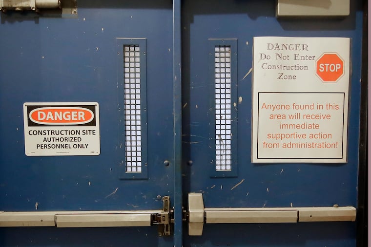 Construction has halted on the building housing Benjamin Franklin High School and Science Leadership Academy. Parents and teachers say health and safety concerns precipitated the shutdown of the $37 million project.