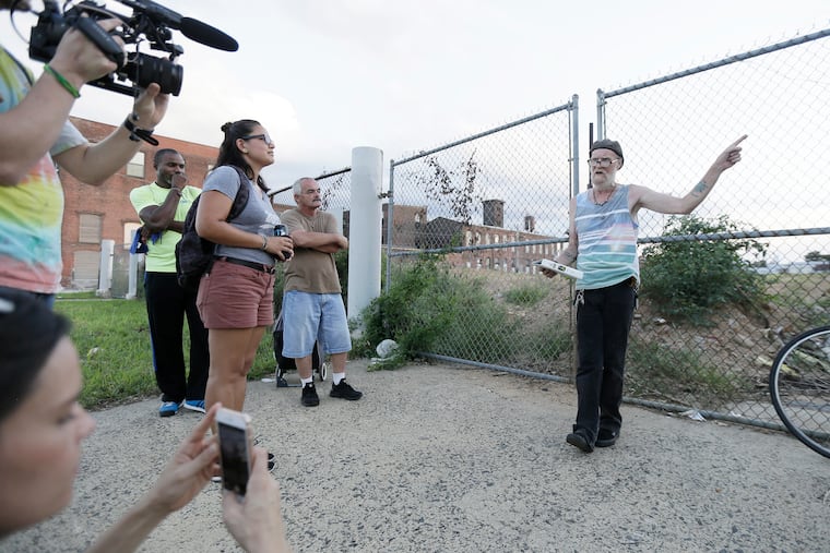 Dennis Payne from Renegade Theater Co.,(far right) helps tells his story of the Kensington neighborhood as he see's it through storytelling, music and drama on Aug. 30, 2018.