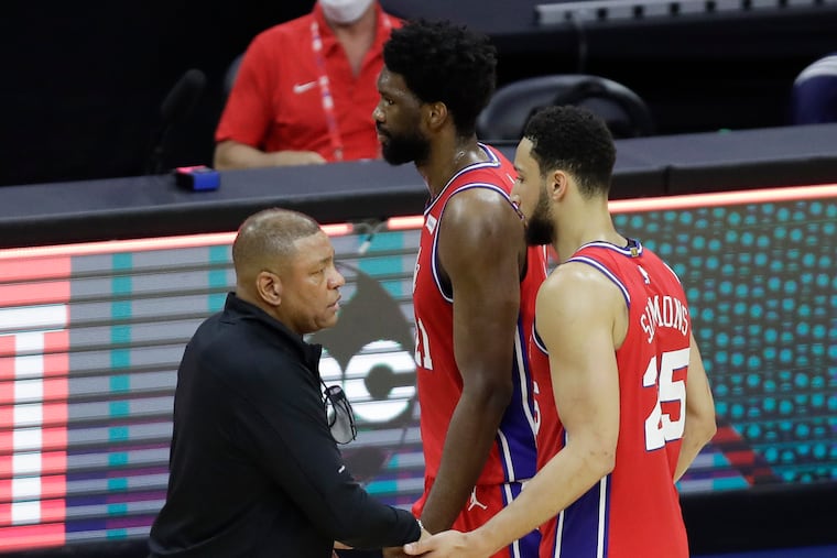 Sixers Head Coach Doc Rivers greets players center Joel Embiid and guard Ben Simmons after the Sixers lost to the Atlanta Hawks 128-124 in Game 1 of the NBA Eastern Conference playoff semifinals on Sunday, June 6, 2021.