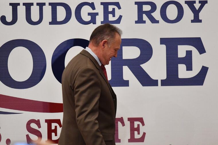 U.S. Senate candidate Roy Moore leaves the stage after speaking at the RSA activity center, Tuesday, Dec. 12, 2017, in Montgomery, Ala. Moore did not concede defeat to his Democratic opponent Doug Jones.