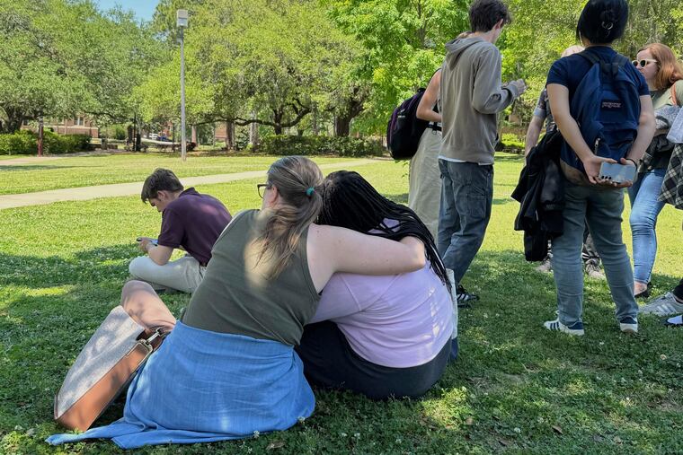 People comfort each other after a shooting on Florida State University’s campus Thursday.