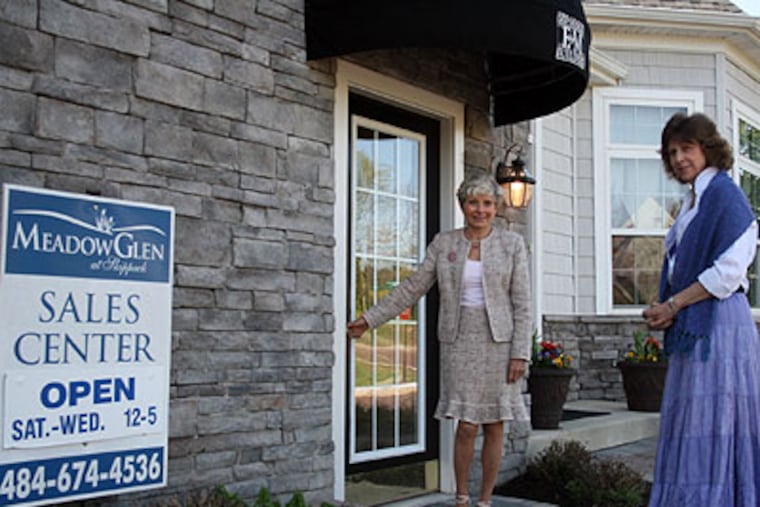 Jan Foderaro, right, with real estate agent Diane Williams, left. Foderaro has signed an agreement to have a house built in the Meadow Glen Development in Skippack Township. (Jimmy Viola / Staff Photographer)
