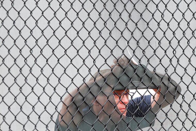 Phillies owner John Middleton has a unique vantage point for watching pitchers throw in the bullpen at the team's spring-training complex in Clearwater, Fla.