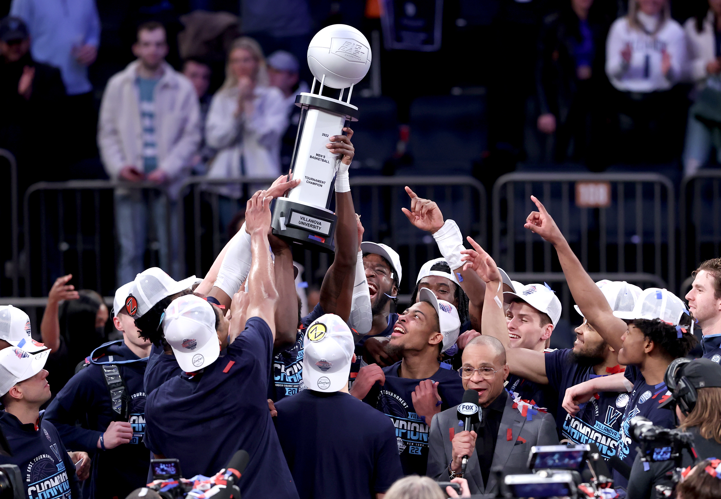 The Villanova team raises the Big East Tournament Championship trophy on March 12, 2022 at Madison Square Garden in New York City.