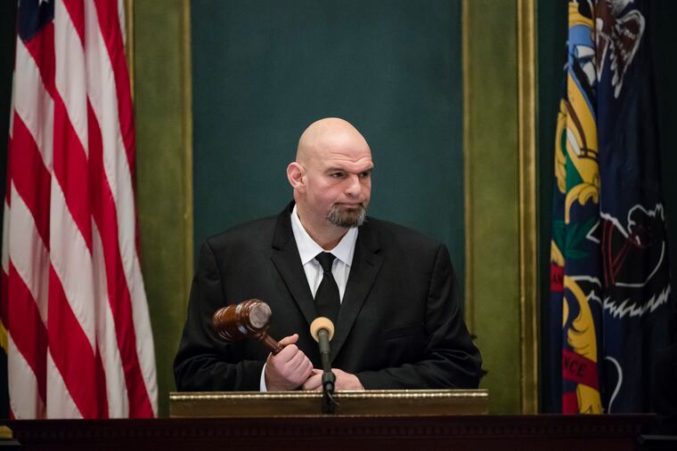 FILE - Pennsylvania Lt. Gov. John Fetterman John Fetterman holds a gavel after he was sworn into office on Jan. 15, 2019, at the state Capitol in Harrisburg, Pa. In 2019, Fetterman's first year in office, he regularly attended ribbon cuttings and conducted a statewide listening tour focused on legalizing marijuana.