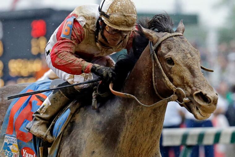 Joel Rosario rides Orb during the 139th Kentucky Derby at Churchill Downs Saturday, May 4, 2013, in Louisville, Ky. (J. David Ake/AP)
