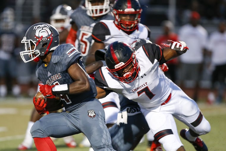 Omar Speights (7) tries to chase down a Simon Gratz ballcarrier in Imhotep Charter's 40-21 victory last season.