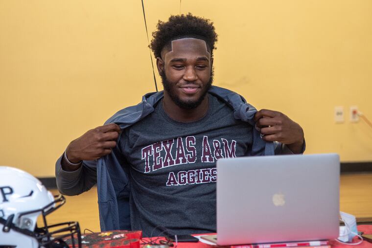Imhotep defensive end Enai White, announces his commitment to play for Texas A&M University , during a press conference at Imhotep High School in Philadelphia, Pa. December 15, 2021.