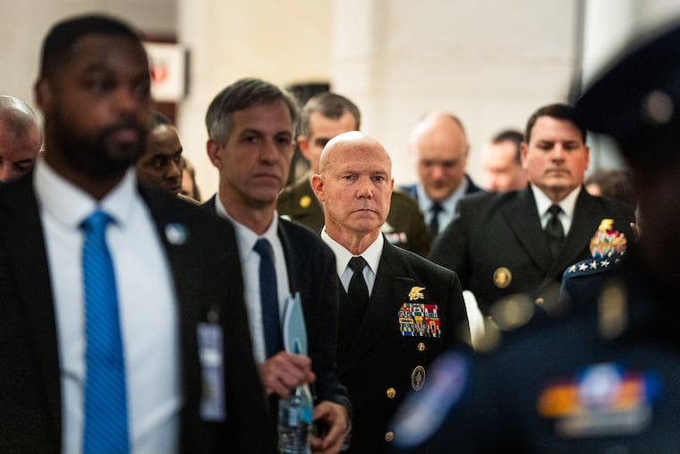 Navy Adm. Frank Bradley heads to a classified meeting with lawmakers on Capitol Hill in December.
