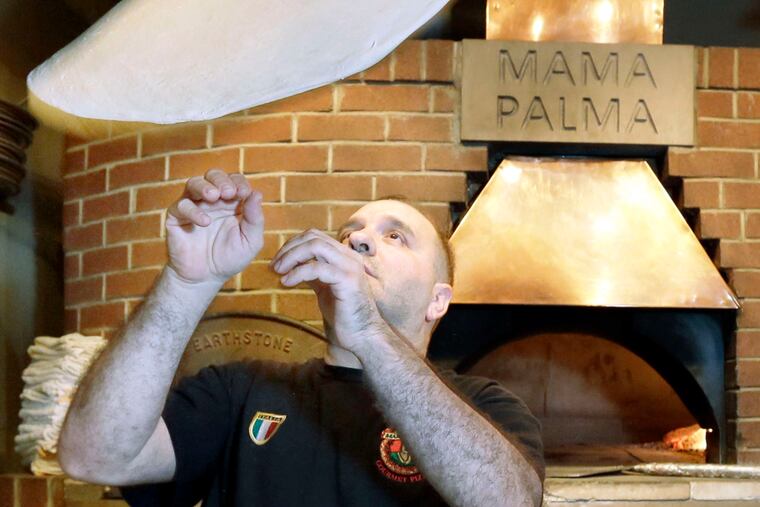 Renato Russo tossing one up there in 2016 at Mama Palma's Wood Fired Brick Oven Pizza.