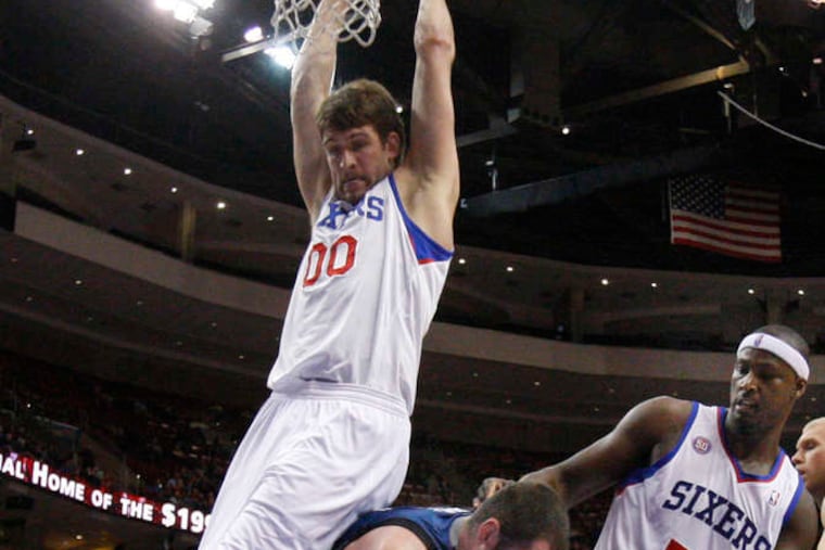 Kevin Love's board work was an afterthought for Minnesota, which shot 53 percent. Above, Spencer Hawes (left) and Kwame Brown are boxed out by Love.