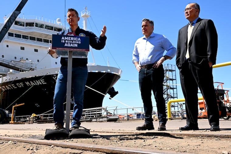 Transportation Secretary Sean Duffy (left) talks with reporters during a visit to the Hanwha Philly Shipyard on Monday. With him are U.S. Sen. Dave McCormick (center) and shipyard CEO David Kim.