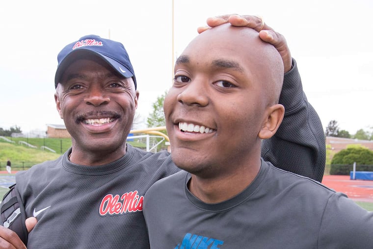 John-Paul Dean , senior at Kennett High School, with track coach Carl Lowe: "He's a great kid 'cause of his leadership. He always wants to go the extra two miles."