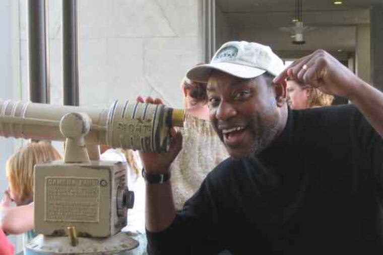 Speaking of Franklins: The institute's chief astronomer, Derrick Pitts, tries out a 25-cent telescope at a shopping center while visiting Los Angeles. He was there last week to talk about Galileo on CBS's "The Late Late Show."