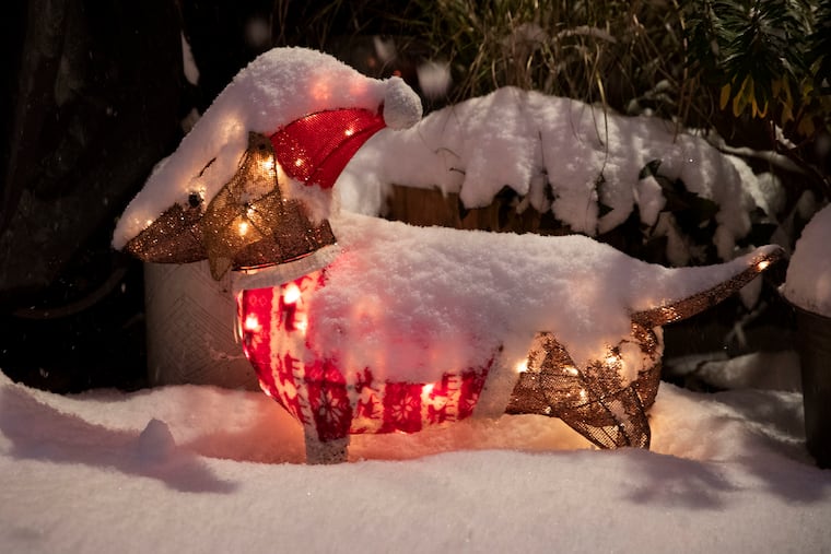Snow covers a Christmas decoration in Brewerytown in December 2020.