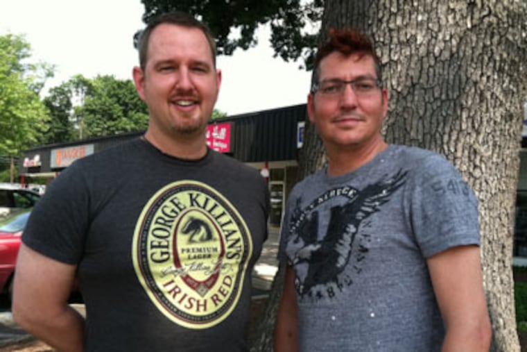 Sander Schlichter, left, and partner Charlie Burrus, right, moved from the Fairmount section to Montgomery County, in part, to get away from city crime. (Julie Shaw / Staff)