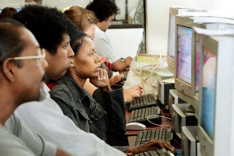 Job seekers look for opportunities and work on résumés at WorkSource California in Los Angeles. Continuing unemployment claims were at their highest since December 1982.