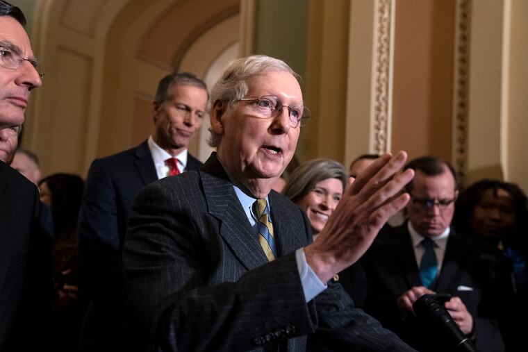 Senate Majority Leader Mitch McConnell, R-Ky., joined from left by Sen. John Barrasso, R-Wyo., Majority Whip John Thune, R-S.D., and Sen. Joni Ernst, R-Iowa, meets with reporters as the House prepares to send the articles of impeachment against President Donald Trump to the Senate, at the Capitol in Washington, Tuesday, Jan. 14.