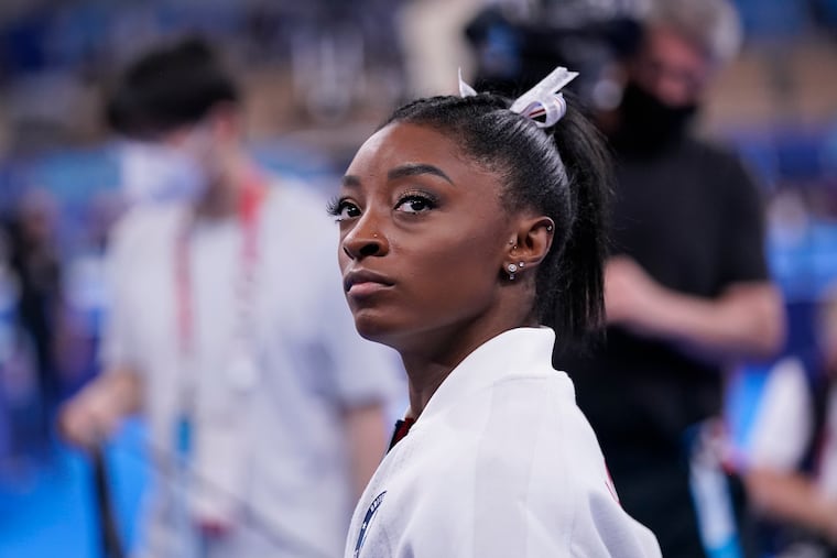 Simone Biles waits for her turn to perform during the Olympics artistic gymnastics women's final on Tuesday in Tokyo.
