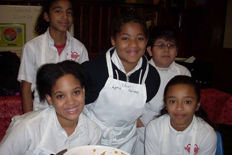 (top row left to right) Samantha Concepcion, Lyric Samuels, Harold Veliz. (front) Tanasha Lopez, Lailani Flores. (Photo by Ruth Biemer
Sacred Heart School)