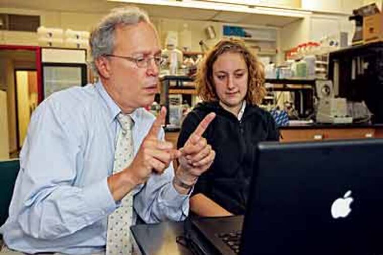 Haverford President Steve Emerson confers with senior Alissa Aron on a project she is presenting at a symposium this weekend at Haverford College. (Michael Bryant / Inquirer)