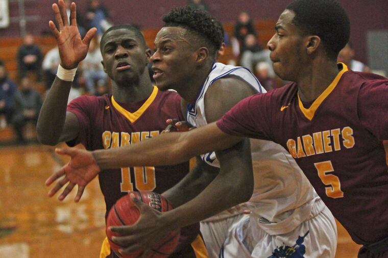 Michael Green of Burlington City draws a double team from Haddon Heights defenders Te'Sean Pressley (10) and Isaiah Turner (5) during the fourth quarter.