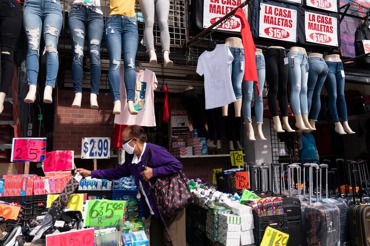 A woman shops at a clothing store in New York.