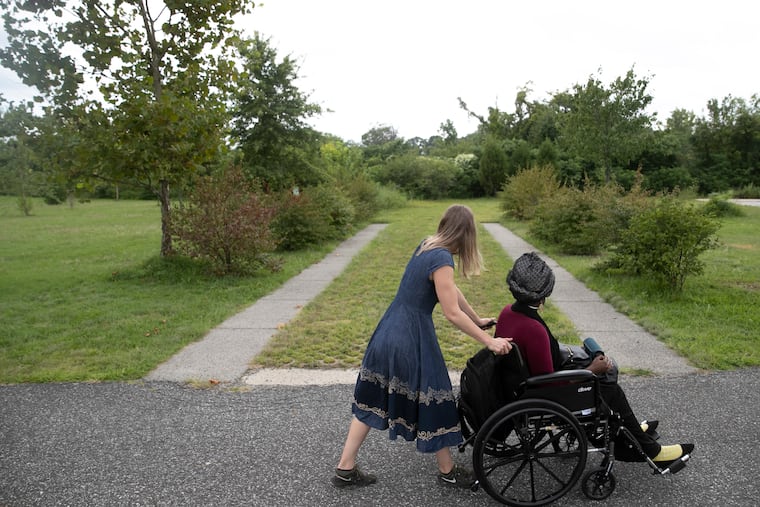 afaq, a Philly-based poet and activist, revisits the Cooper River Trail with Adrienne Mackey as they listen to the poetry afaq wrote for the new app, Trail Off, in Pennsauken Township, NJ on Wednesday, Sept. 02, 2020. Trail Off is a new app that offers audio experiences for 10 trails in the region. Each audio story has been penned by a different author, including afaq. Mackey is the founder of Swim Pony, the performing arts group behind the app.