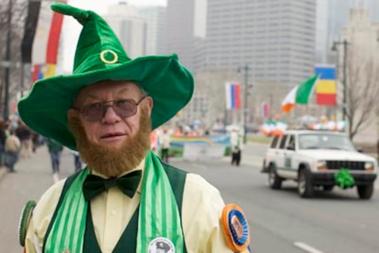 Bob Nerch, 70, marched with the St. Thomas Moore High School Alumni Association at the St. Patrick's Day Parade on Sunday. (Rahul Coutinho / Staff Photographer)