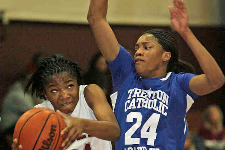 Canty guards Alliya Butts of Holy Cross. "People see us winning championships and working hard, and they just want to be a part of it," the Rutgers-bound Canty said.