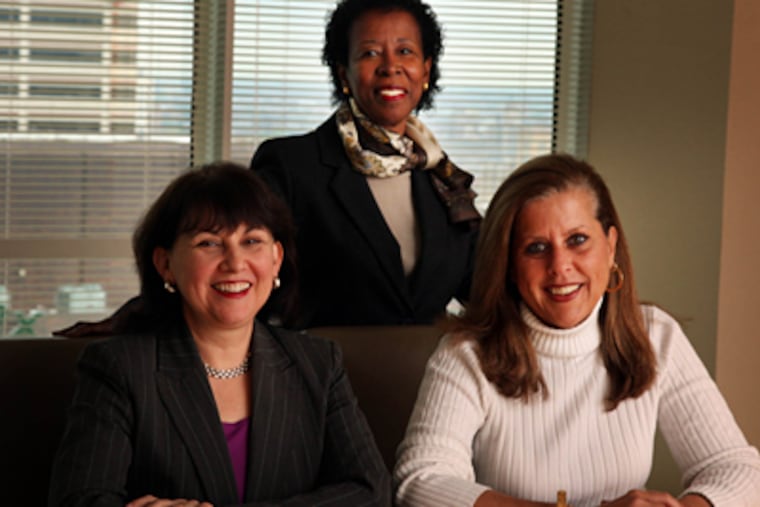 Deborah Margulies, Irene Bigby and Kathy Gallelli, managers at WolfBlock in Philadelphia, sit in the firm's empty conference room. Theyare some of the managers left behind to close the operation after thelaw firm went out of business. (Laurence Kesterson / Staff Photographer)