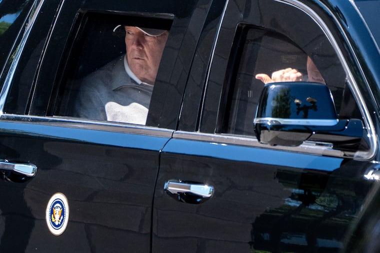 President Donald Trump looks out the window of his limousine at the construction in Lafayette Park as he departs the White House, Saturday, May 30, 2026, in Washington.
