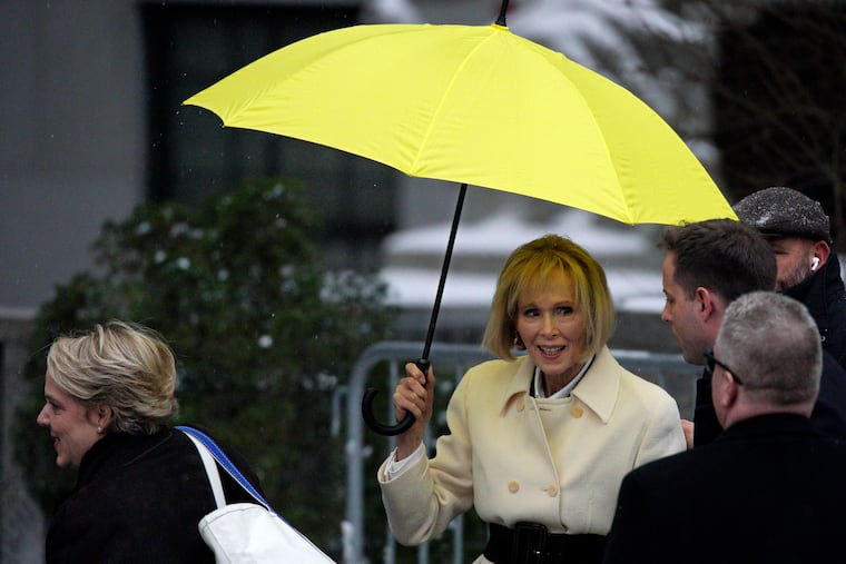 E. Jean Carroll, right, holds her umbrella as she arrives, with her attorney Roberta Kaplan, left, at federal court in New York on Tuesday, Jan. 16, 2024.