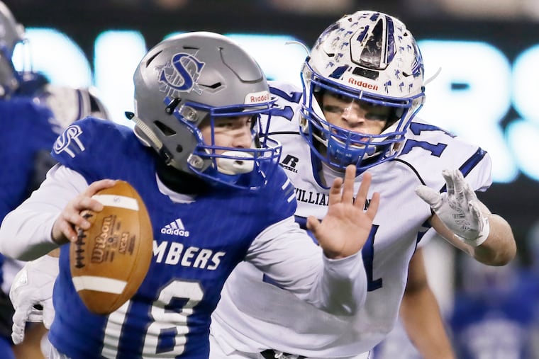 Williamstown junior Aaron Lewis (right) is about to sack Sayreville quarterback Mark Whitford.