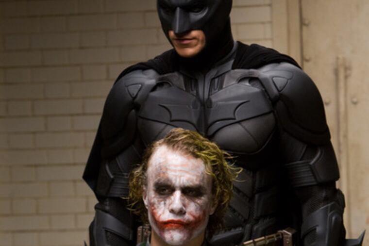 "The Dark Knight" stars Christian Bale (top) and Heath Ledger.