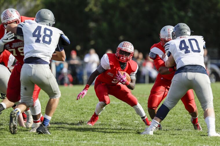 St. Joseph High’s Jada Byers runs with the football during the fourth quarter against St. Augustine Prep on Saturday.