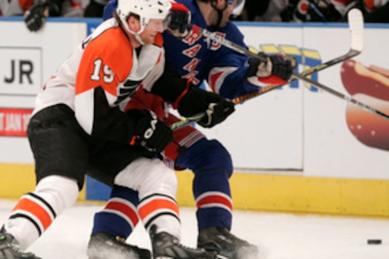 The Flyers' Scott Hartnell gets tough with the Rangers' Jaromir Jagr. "I was around the net, banging pucks in," Hartnell said.