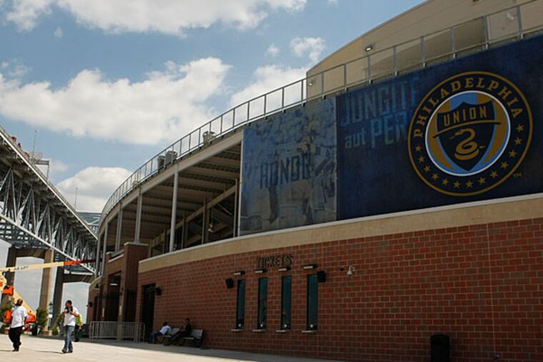 With the Philadelphia Union in their fifth season, PPL Park, in the shadow of the Commodore Barry Bridge, remains an island among vacant land and dilapidated buildings. (Ron Cortes/Staff file photo)