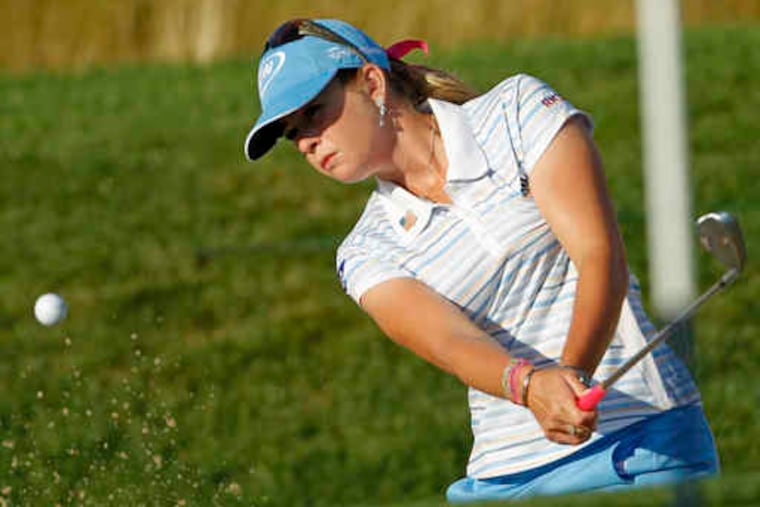 Paula Creamer hits out of a bunker during the third round of the U.S. Women's Open Championship at Oakmont Country Club. Creamer is 1 under for the tournament through 13 holes of the weather-delayed third round. That round will be completed Sunday morning.
