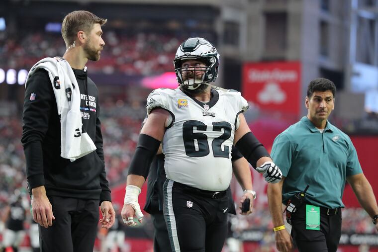 Eagles center Jason Kelce walks to the locker room after he was injured against the Cardinals on Sunday.