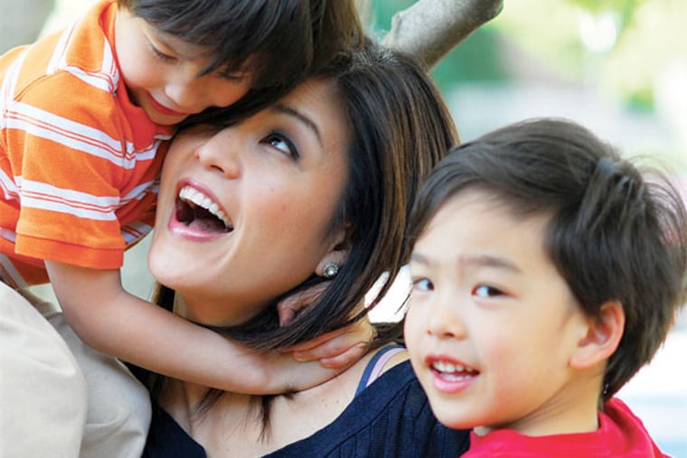 Denise Nakano of NBC 10 with Kyle (in orange) and Shane (in red).