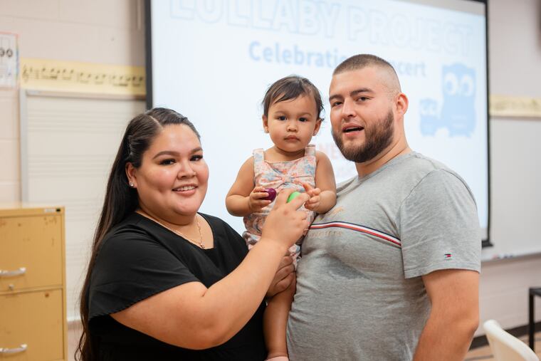 Alondra Gomez and Samuel Ramirez pose with their 1-year-old child Milani Ramirez during a Lullaby Project performance at Rowan University in Glassboro on Friday, June 30, 2023. The Lullaby Project is a project of Carnegie Hall, partnering with other music and social programs in the US and other countries in which caregivers create lullabies for their babies, but in the process think about being caregivers and what they want for their children.