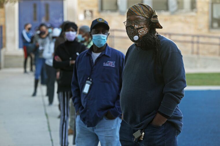 Voters waited in line Wednesday at an early voting site at Deneen Elementary School in Chicago.