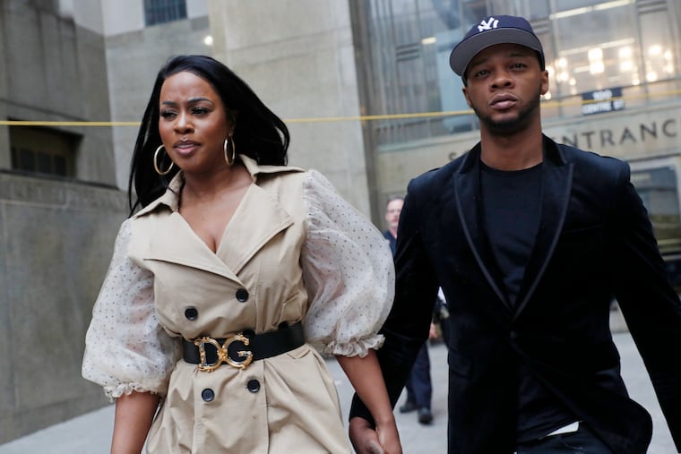Rapper Remy Ma, left, leaves Manhattan Criminal Court, with her husband Papoose, also a rapper, after she was arraigned on a assault charge Wednesday, May 1, 2019, in New York. Ma is accused of punching her "Love & Hip Hop New York" co-star Brittney Taylor in the face during an April 16 concert at Irving Plaza in Manhattan. (AP Photo/Kathy Willens)