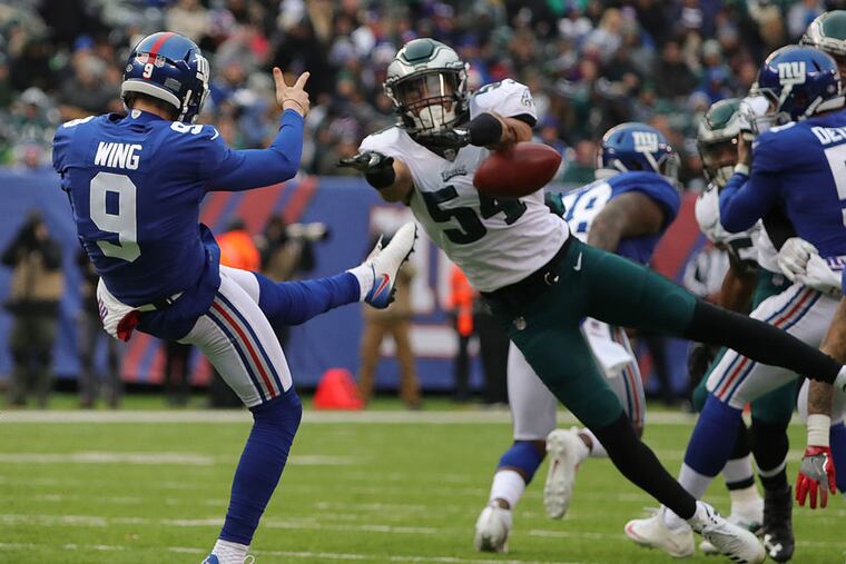 Kamu Grugier-Hill blocks a punt by the Giants' Brad Wing in the second quarter, one of key three blocks by special teams in the Eagles' Dec. 17, 2017 victory. Grugier-Hill has worked to build an important defensive role, in addition to playing special teams.