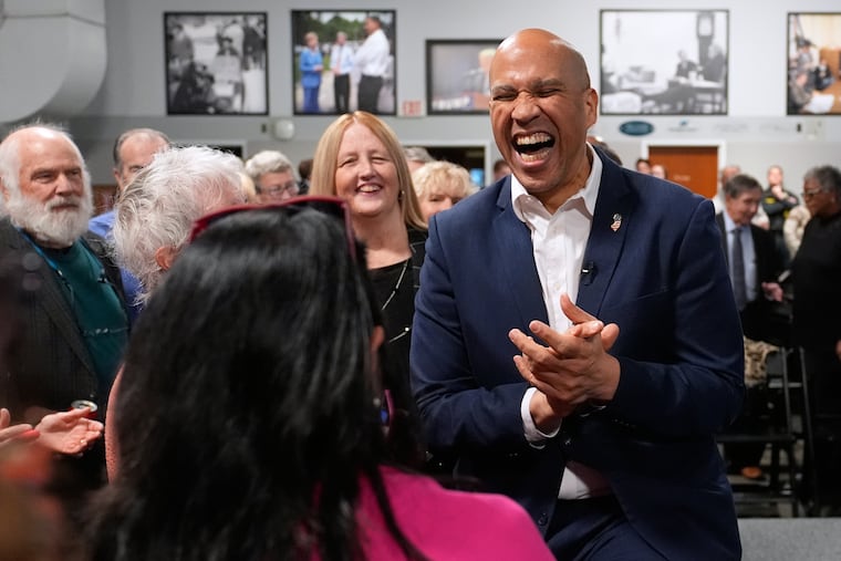 Sen. Cory Booker (D., N.J.) laughs with guests during a gathering last year in New Hampshire, an early presidential state.